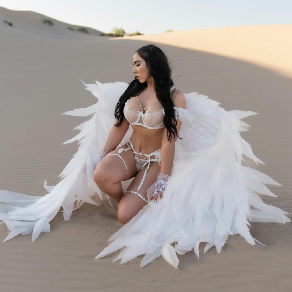 girl in desert in angel costume