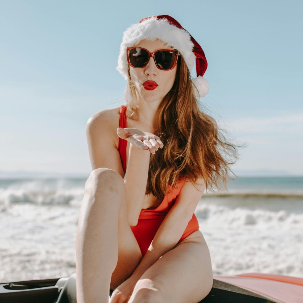 beautiful woman on the beach in xmas outfit