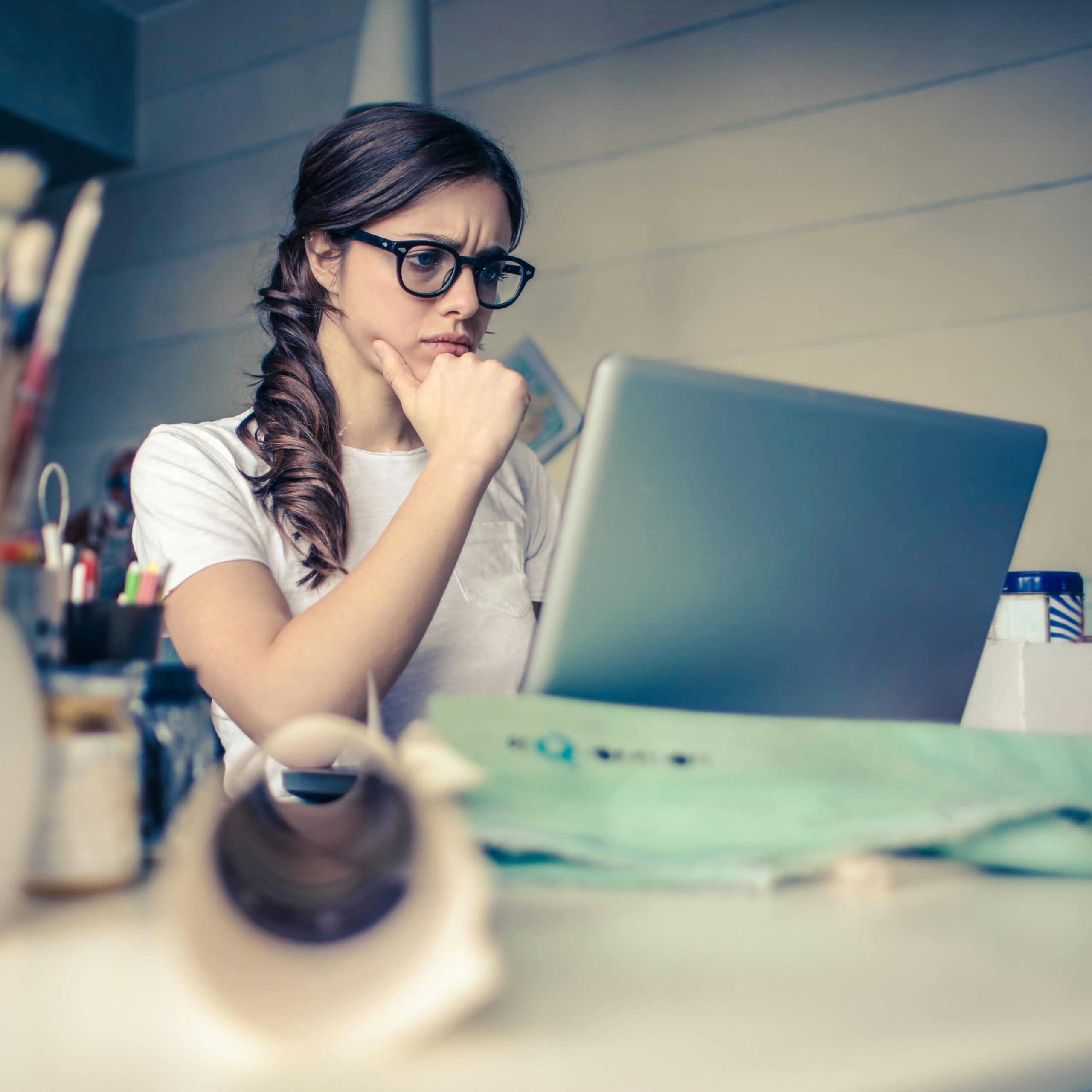 woman with glasses on laptop scaled