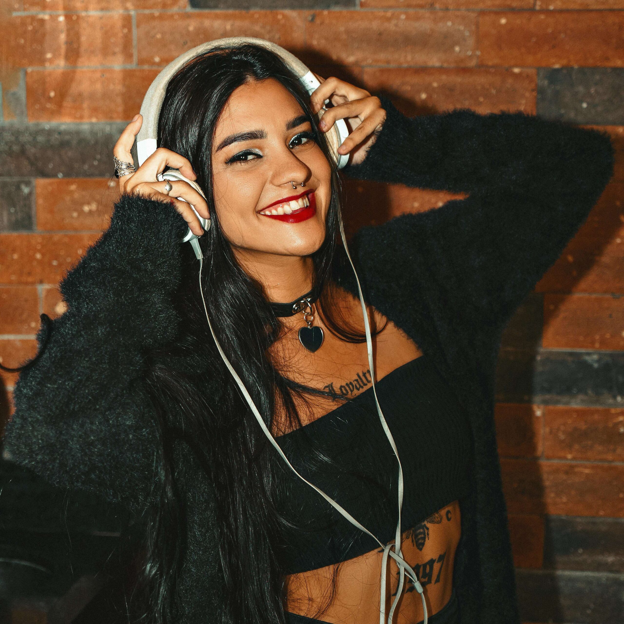 Stop Losing Money: The Real Cost of Fees Across Content Platforms 2 girl with headphones posing for camera scaled